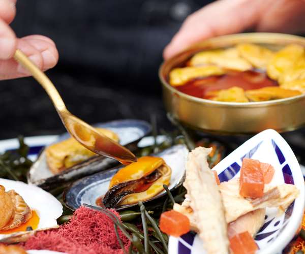 Chef garnishing plate