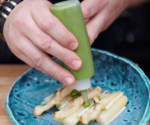 White asparagus being garnished