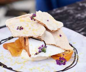 Pastry garnished with purple flowers