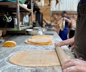 Chef rolling pastry