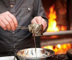 Chef plating seaweed pasta